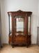 Louis XV display cabinet ensemble in solid brown wood.