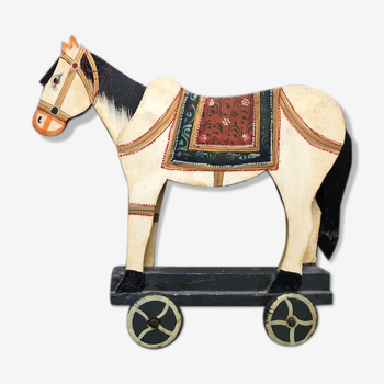 Old wooden wheeled horse toy