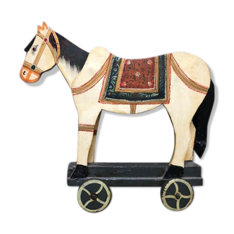 Old wooden wheeled horse toy