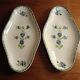 Two iron clay bowls decorated with cornflowers.