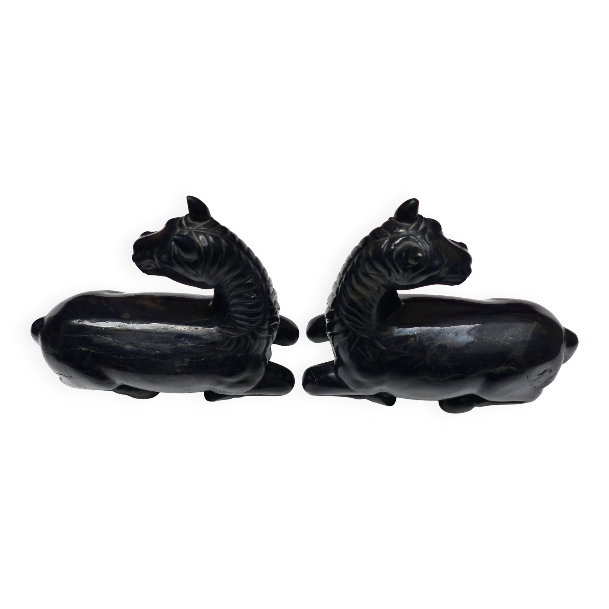Black marble bookends with lying horses