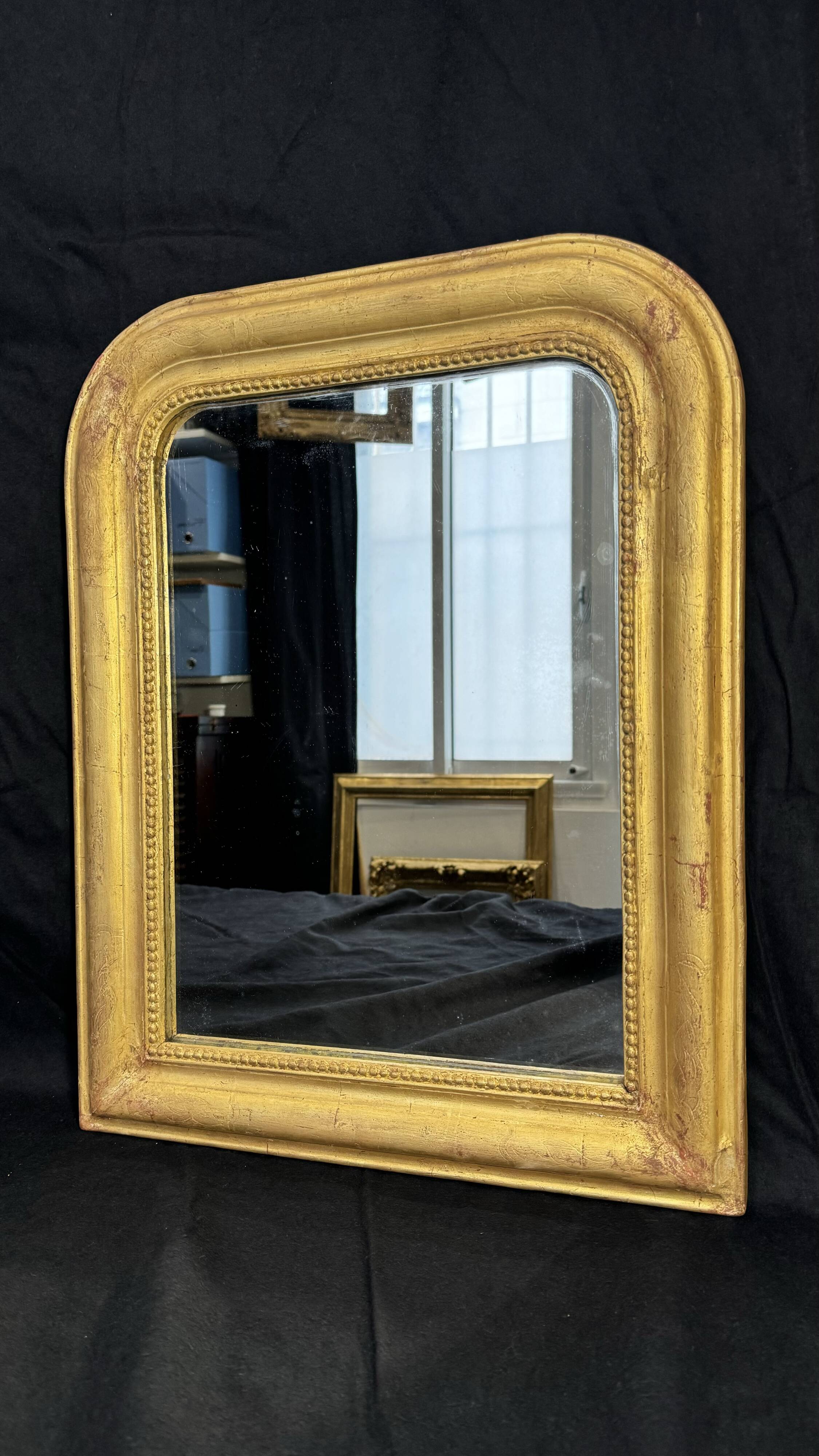 Louis-Philippe mirror gilded with gold leaf