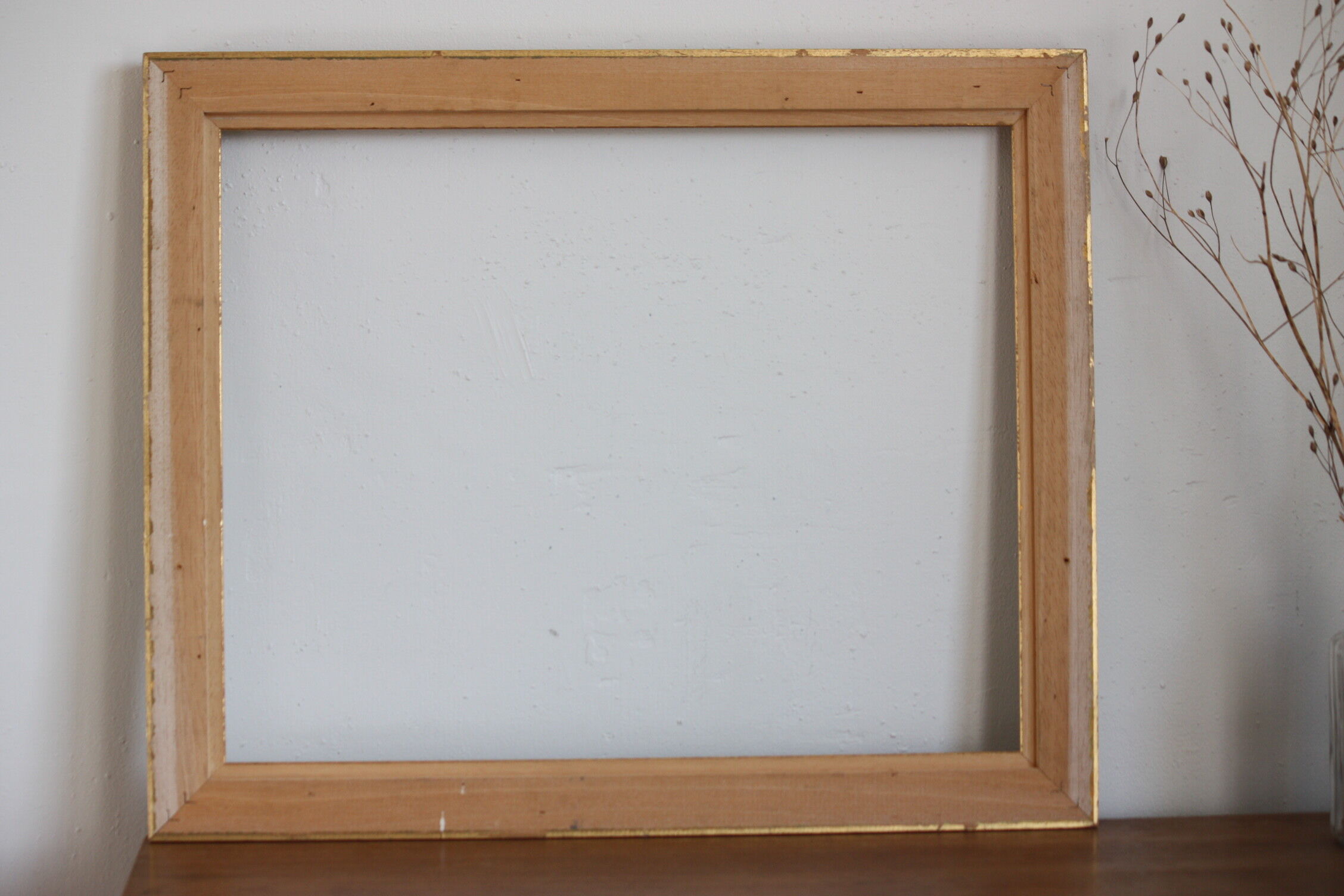 Frame in gilded and green wood