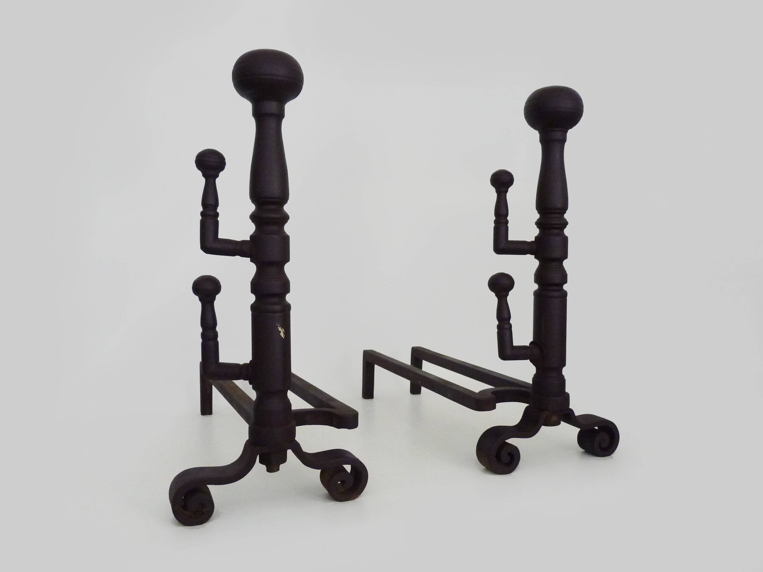Large pair of wrought iron fireplace andirons. France, 19th century.