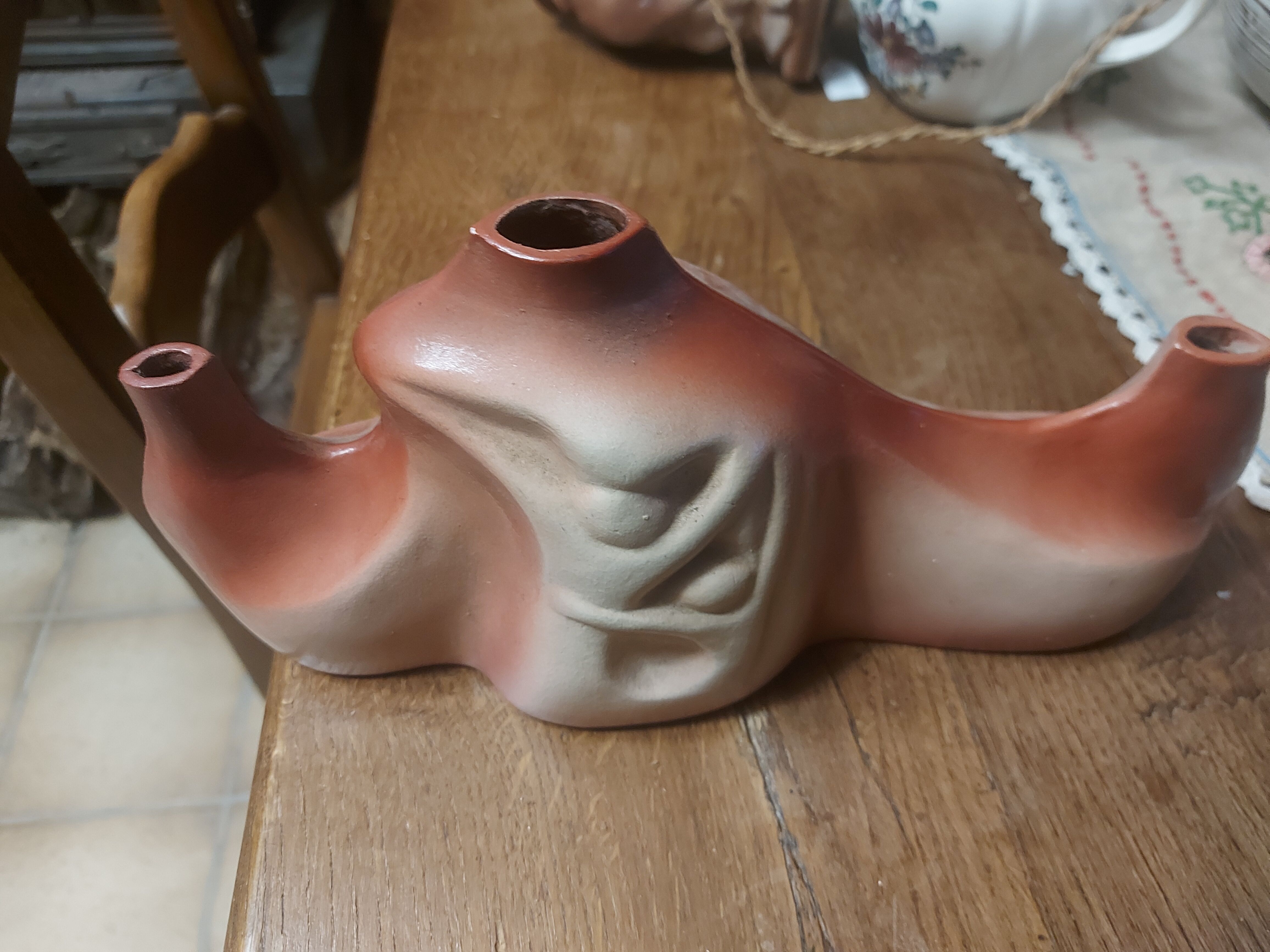 Decorative ceramic vase with organic shapes in Art Nouveau style.