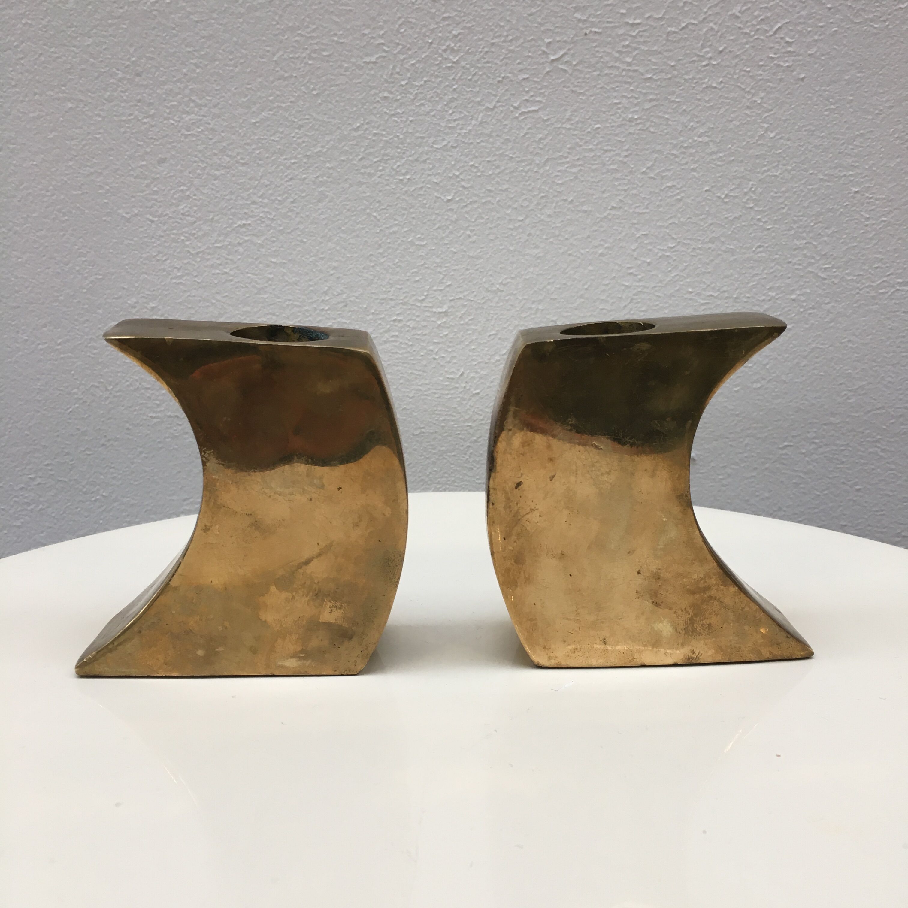 Pair of bronze candle holders by Monique Gerber
