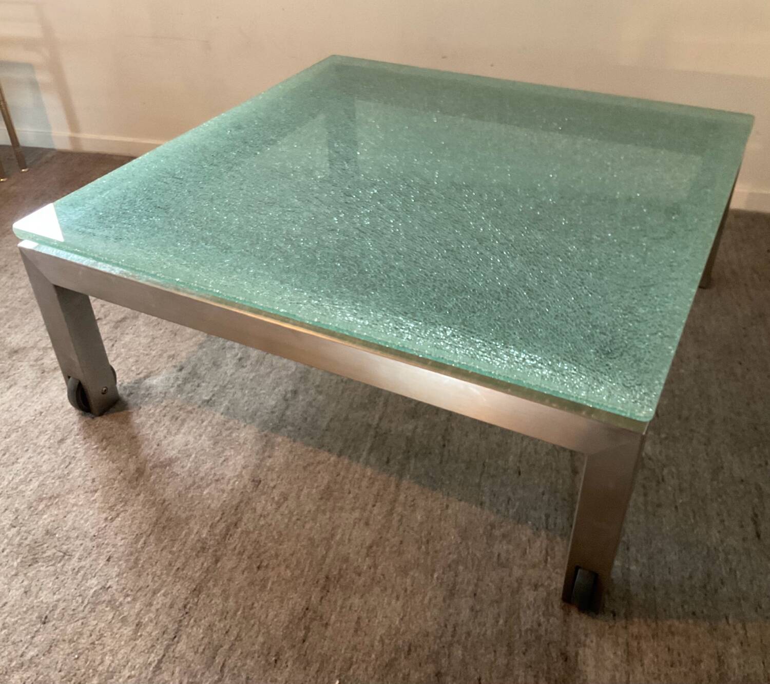 Designer garden coffee table in tempered glass and stainless steel