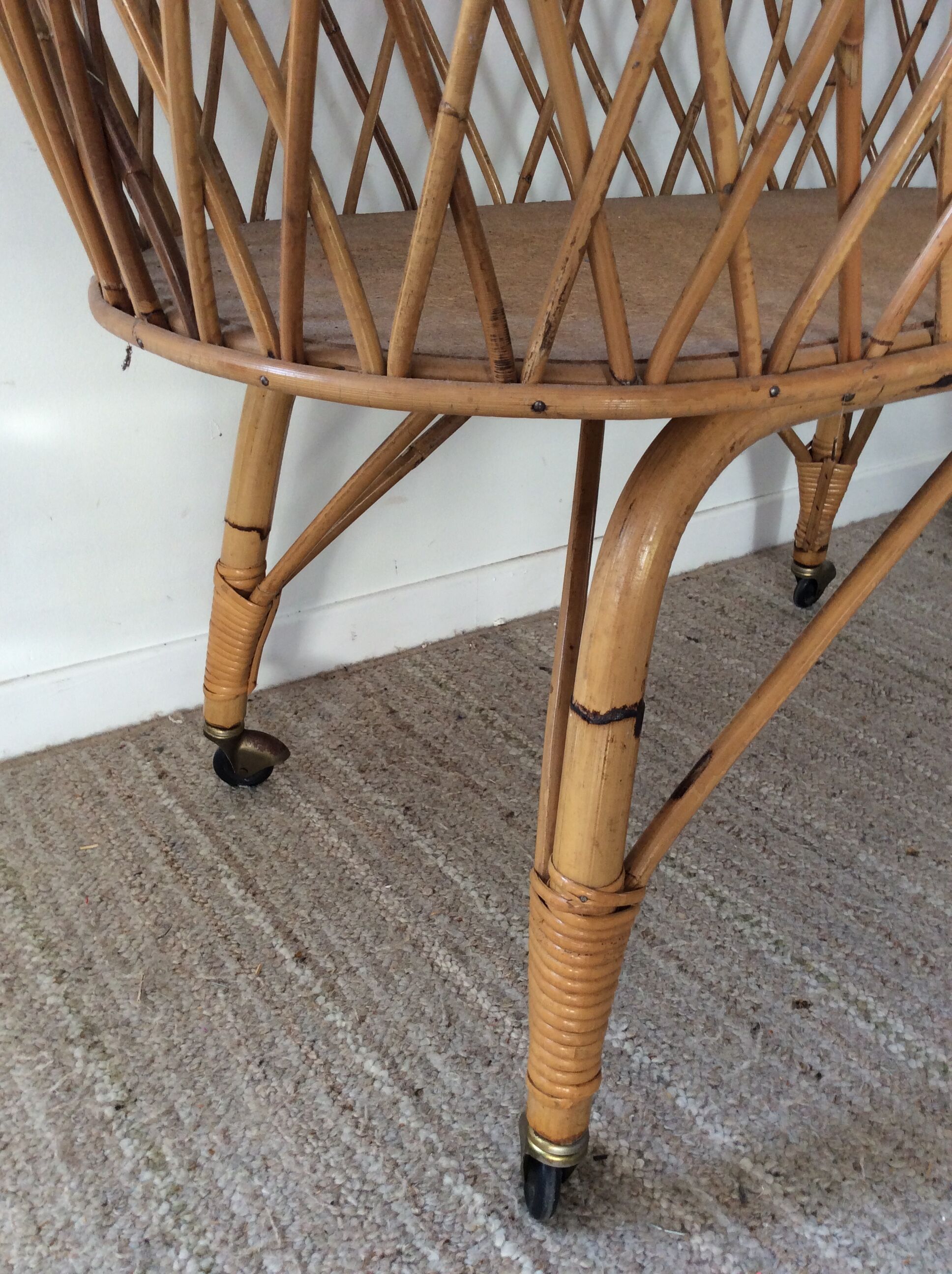 Vintage rattan cradle with its spire