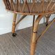 Vintage rattan cradle with its spire