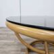 Table basse ronde vintage en bambou et verre fumé