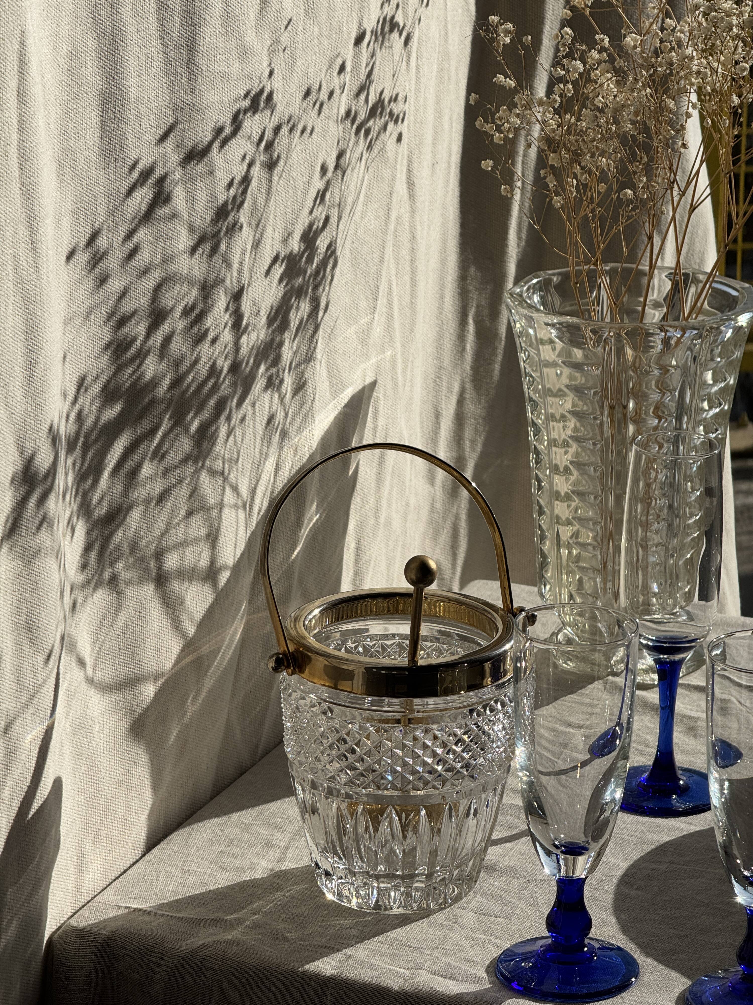 Small golden glass ice bucket with diamond point design and its scoop.