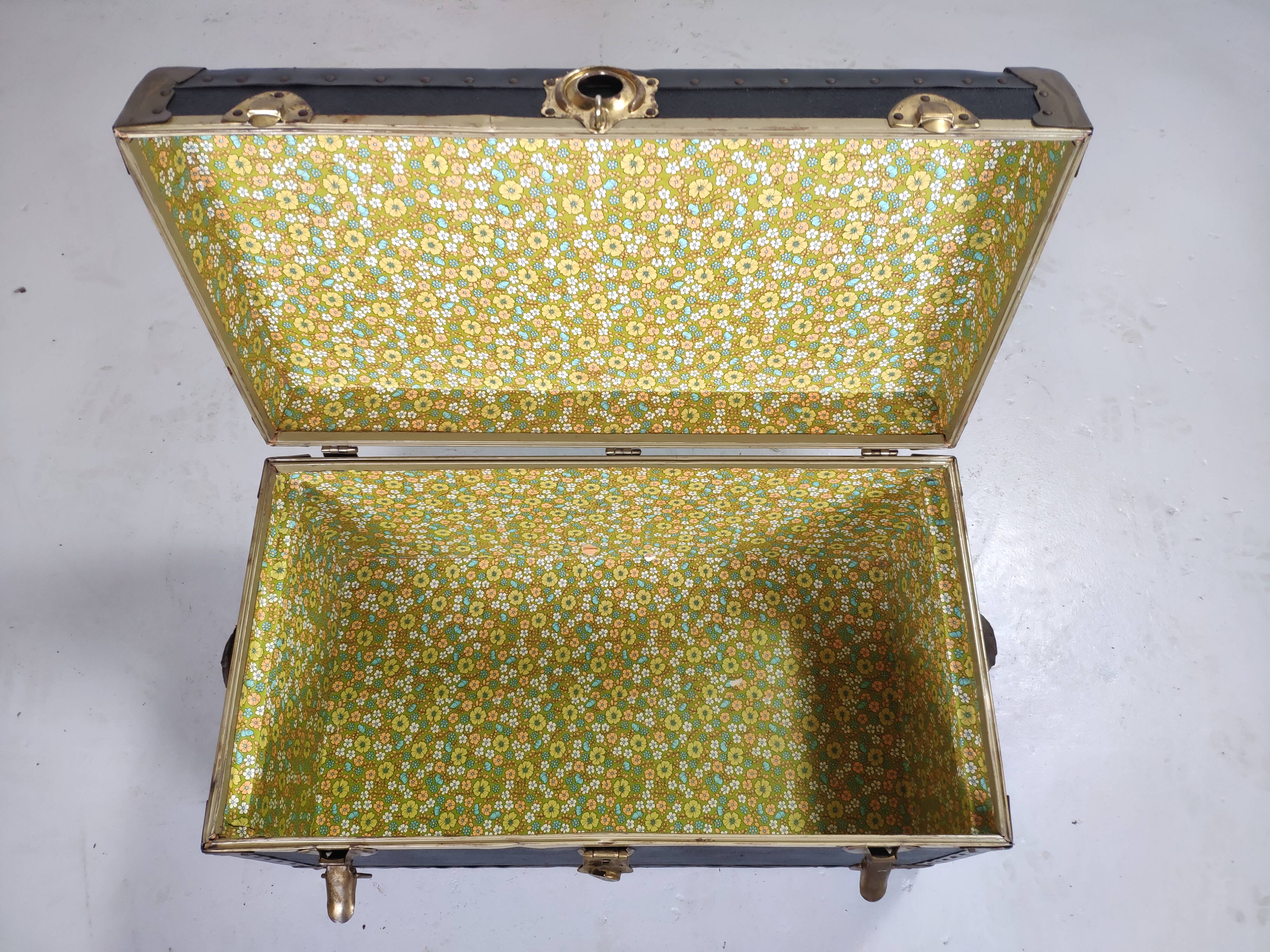 Old black trunk and brass