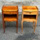 2 bedside tables in transitional or Louis XV style, made of curved solid wood with drawers.