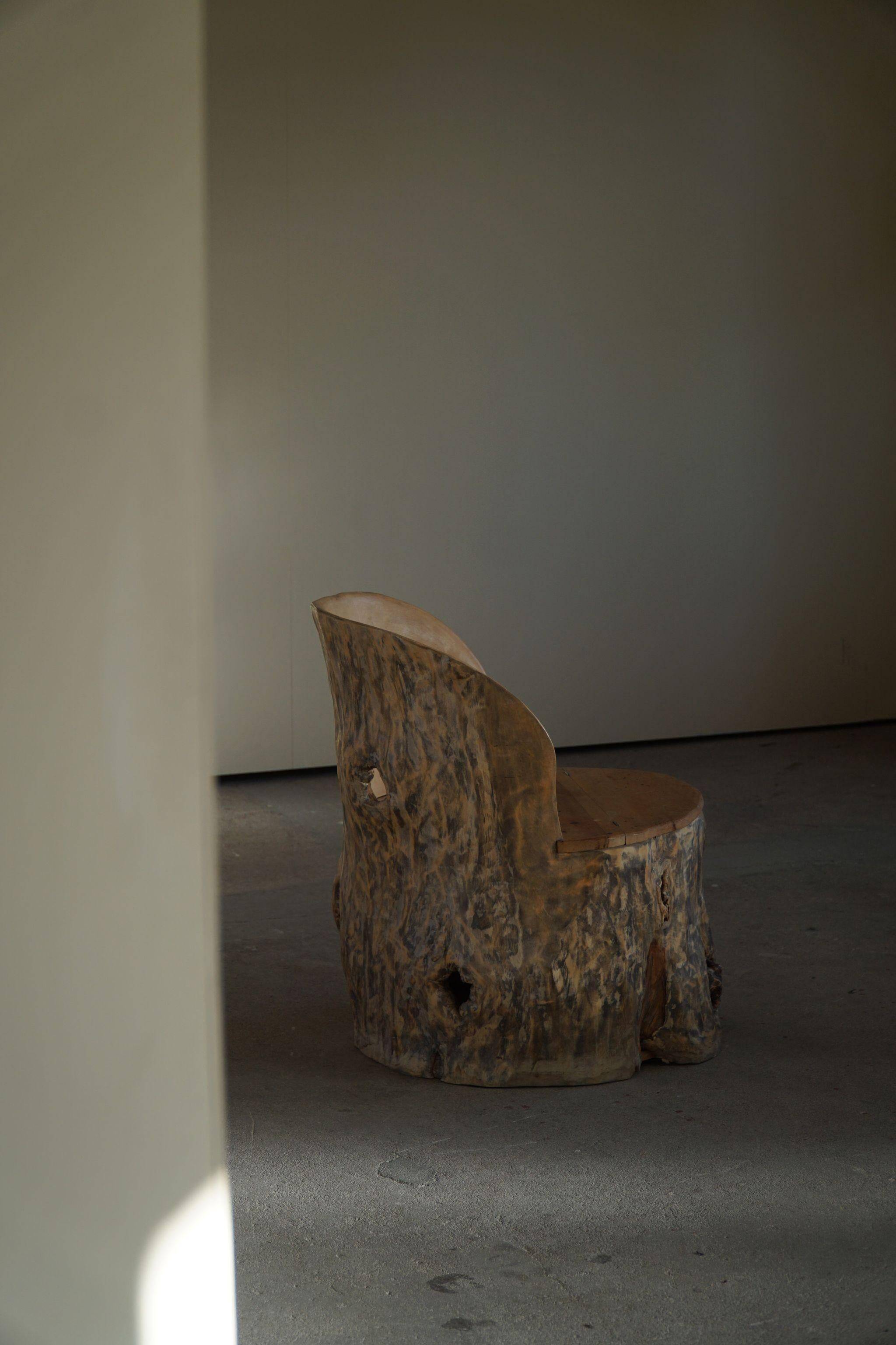 Sculptural Norwegian trunk chair in mid-century brutalist solid wood.