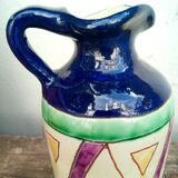 Vintage ceramic pitcher with geometric patterns