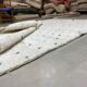 White wool mat with stitches