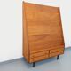 Vintage wooden display bookshelf with drawers from the 1960s.