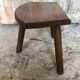 Old vintage wooden tripod milking stool