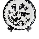 Terracotta plate, Jean Lurçat decorated with a character on a white background.