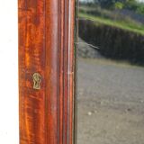 Large antique mirror in a flame mahogany frame; 132x82 cm