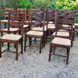 Suite of 17 straw chairs with high backs