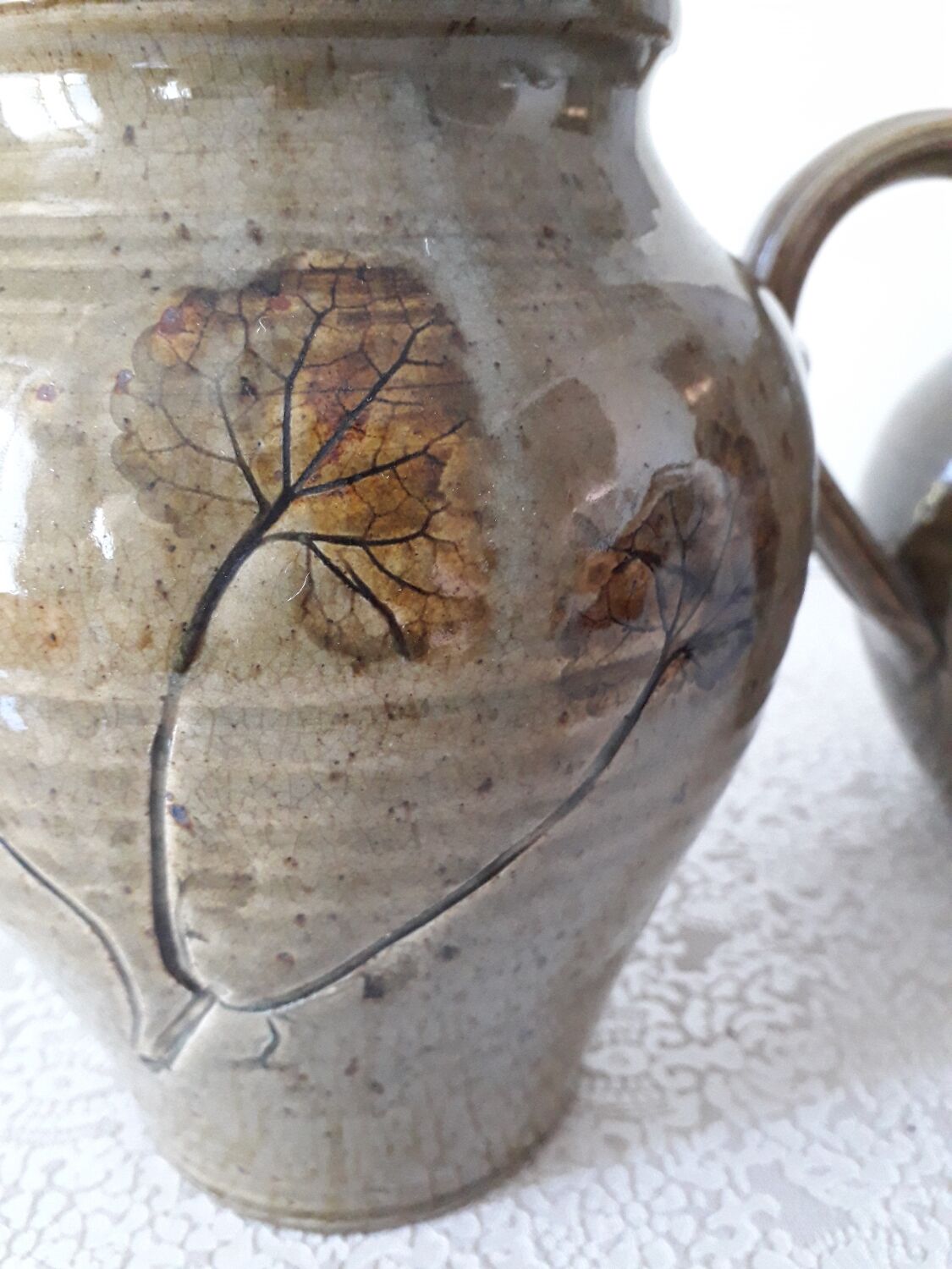 Le Rivet enamelled stoneware carafe and pot with herbarium motifs