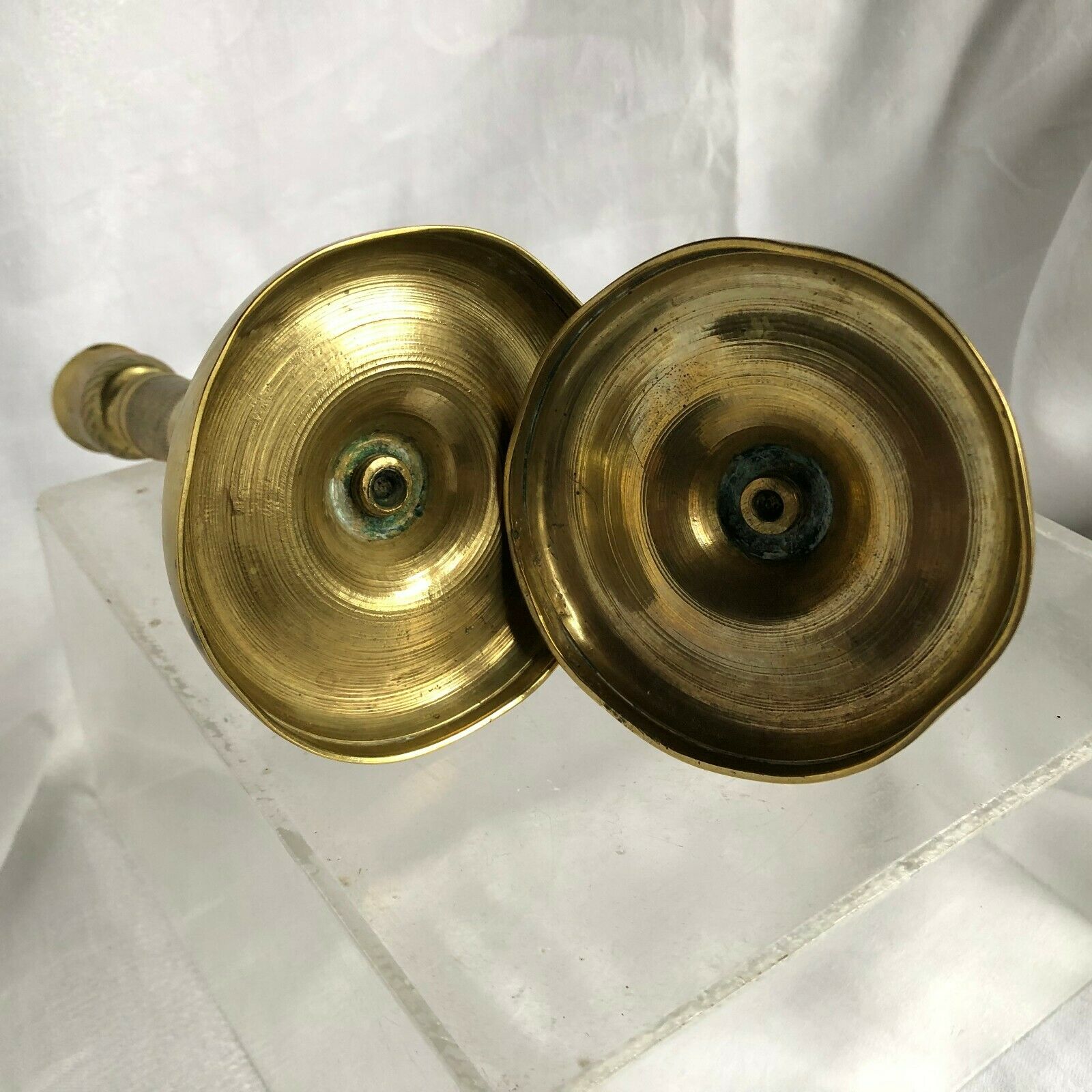 Pair of bronze and brass candlesticks