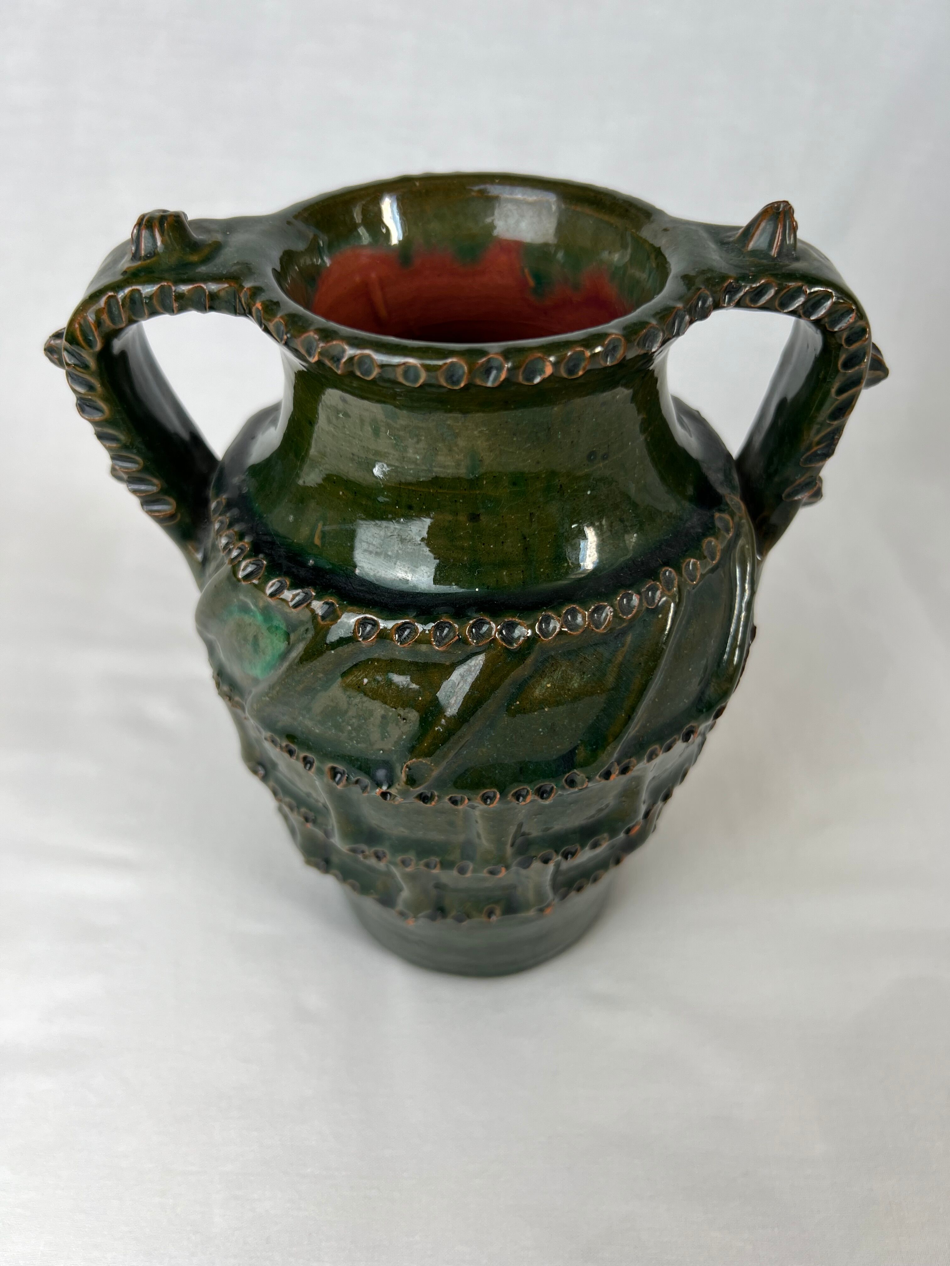 Terracotta jar with dark green handles