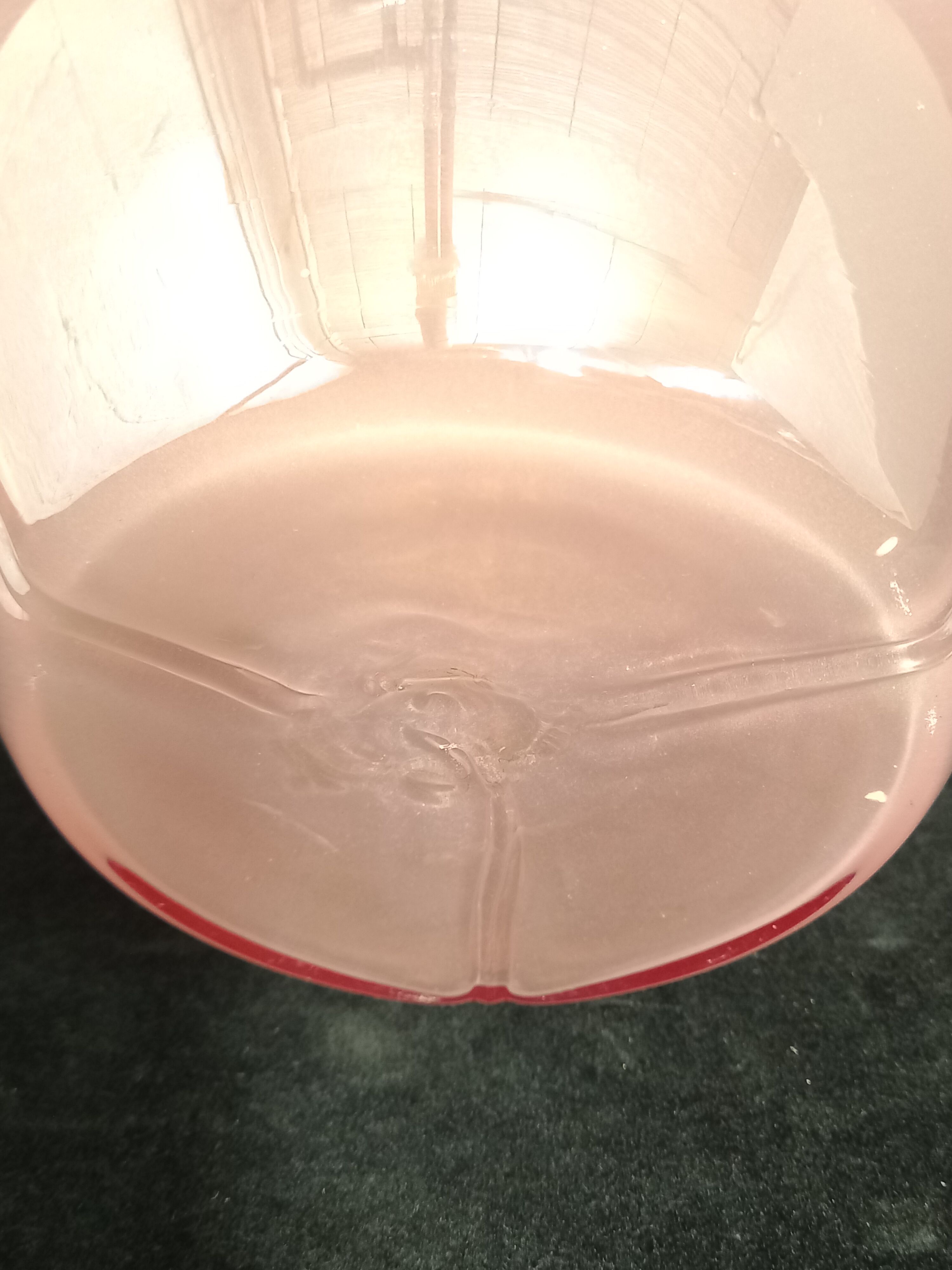 Pearl pink art glass vase with trilobe drawn edge