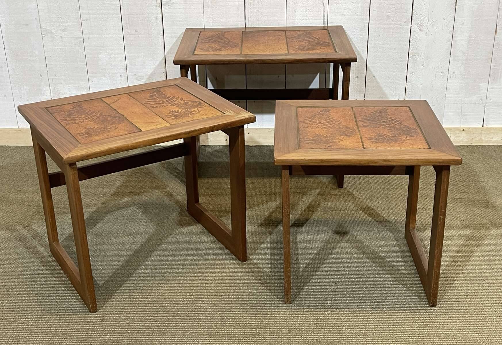 Set of 3 nesting tables in teak with tiled tops.