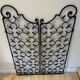 Ancient pair of door opening gates has hell volutes forged craftsmanship