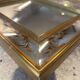 Large Venetian-style mirror with golden floral decoration.