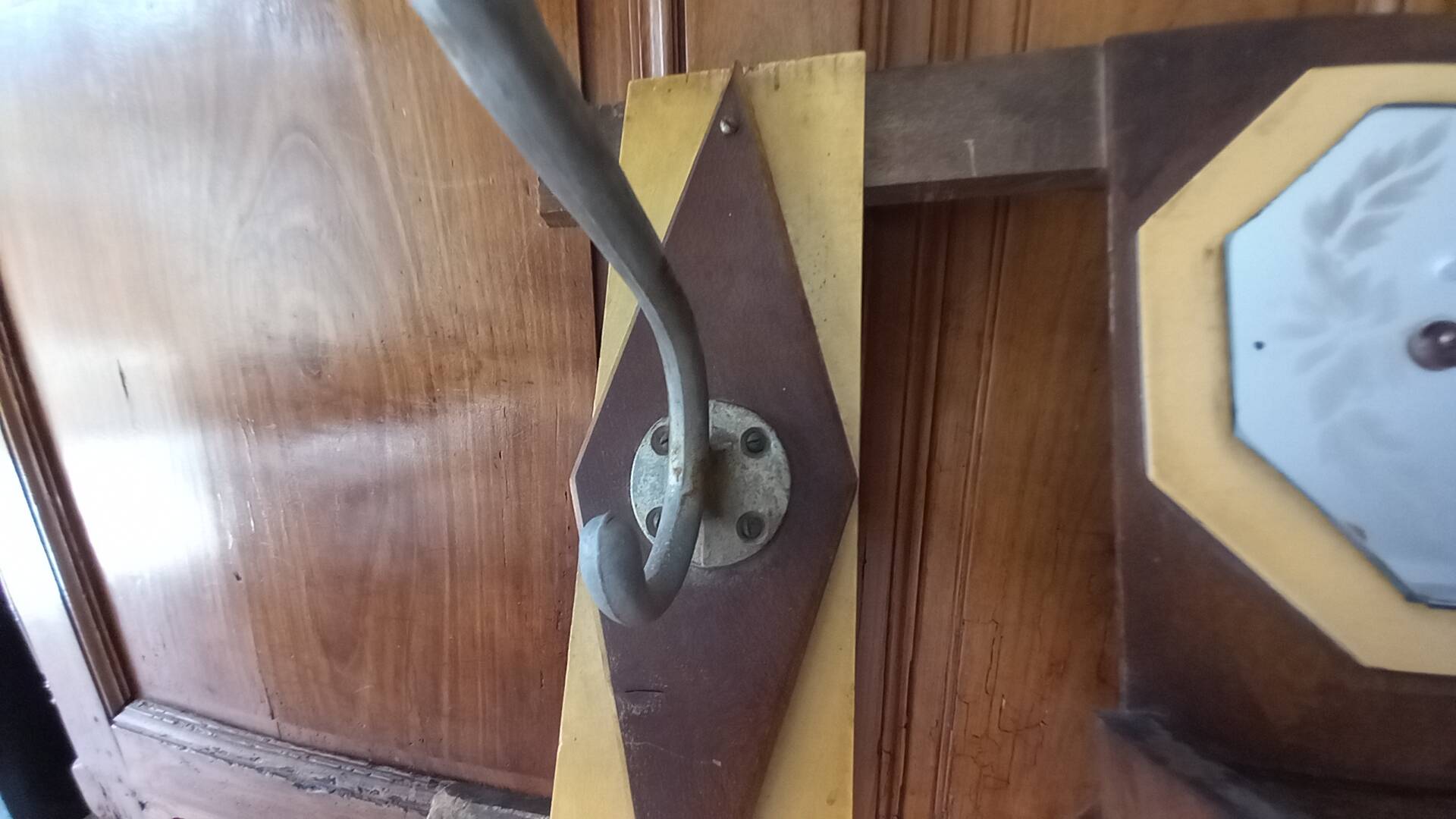 Vintage Art Deco wall coat rack in two-tone wood with engraved mirror.