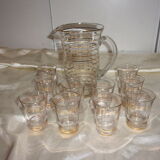 Service in glass pitcher and 10 glasses