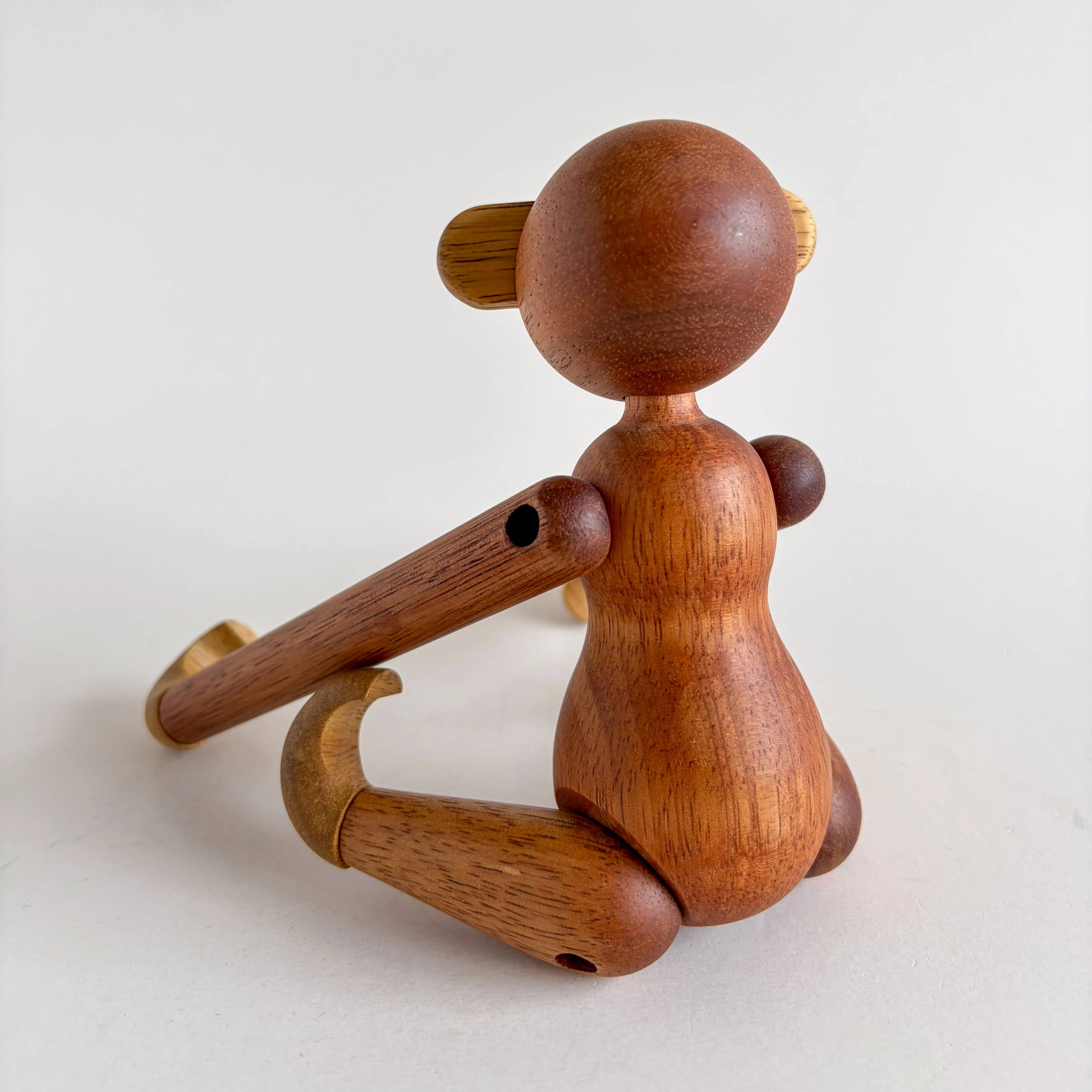 Teak monkey figurine