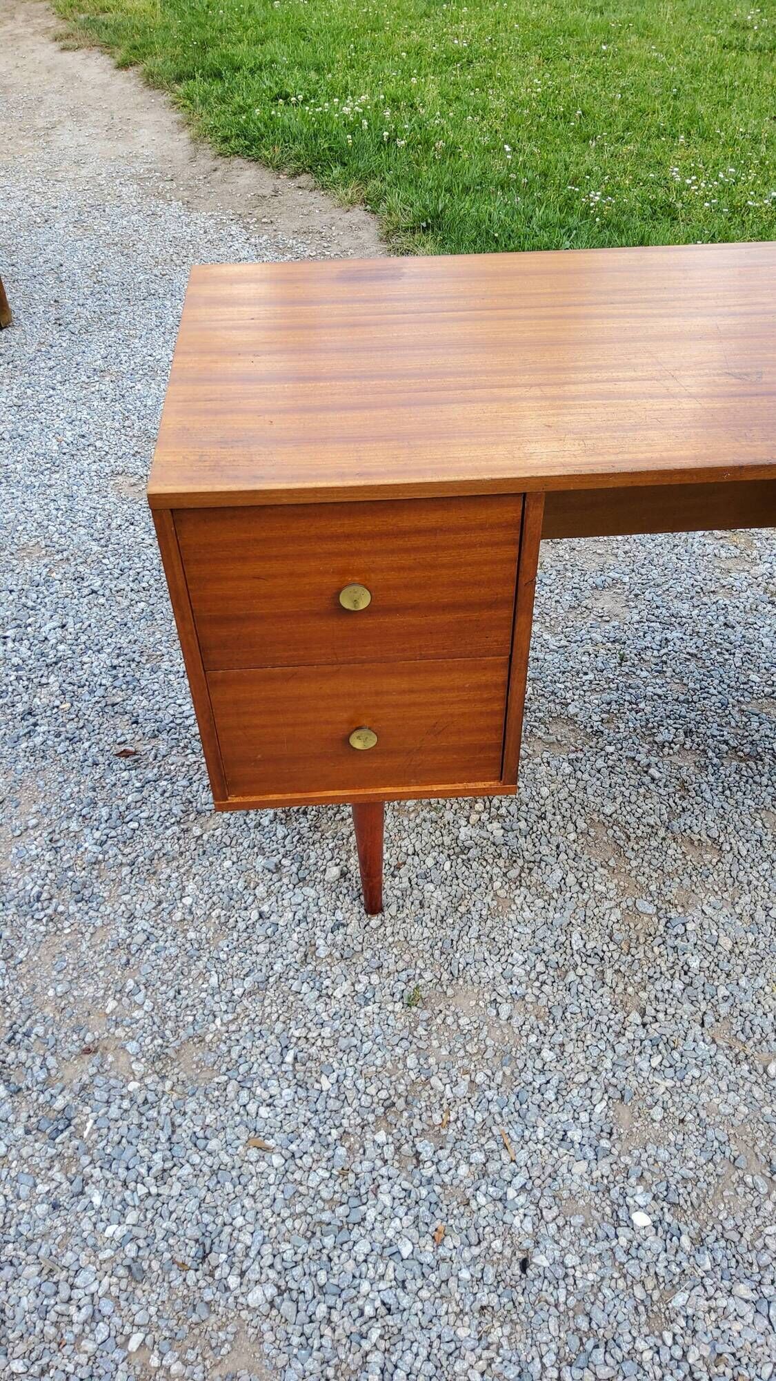 60s desk in golden blond mahogany with conical coffered feet