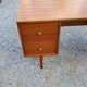 60s desk in golden blond mahogany with conical coffered feet