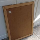 Large beveled mirror in carved wood