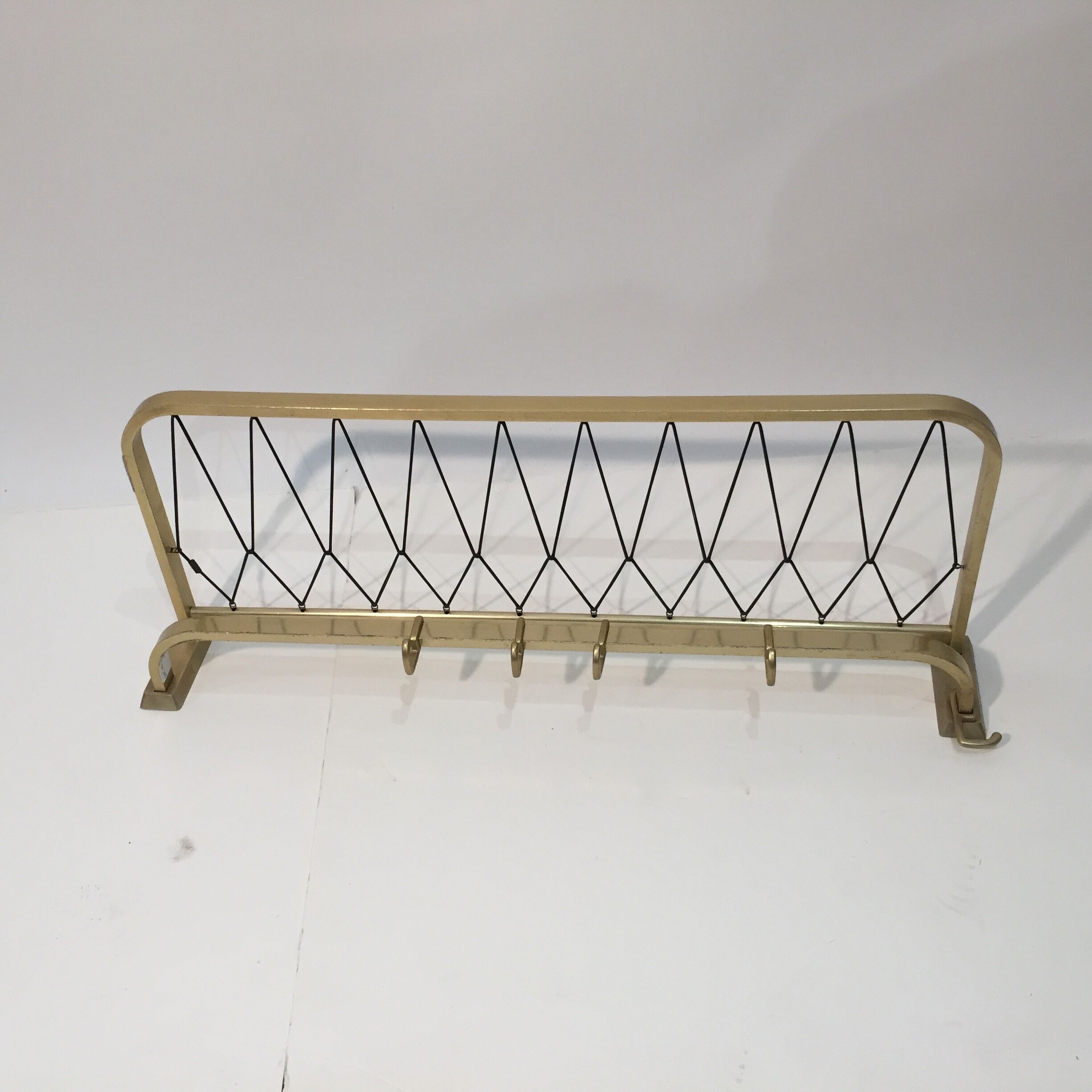 Golden wall coat rack