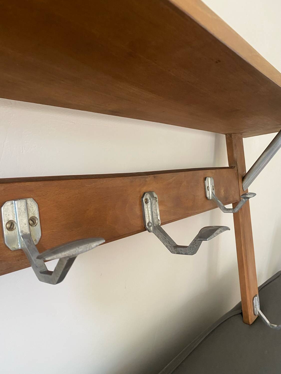 Wall-mounted coat rack with vintage hooks