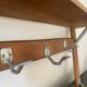 Wall-mounted coat rack with vintage hooks