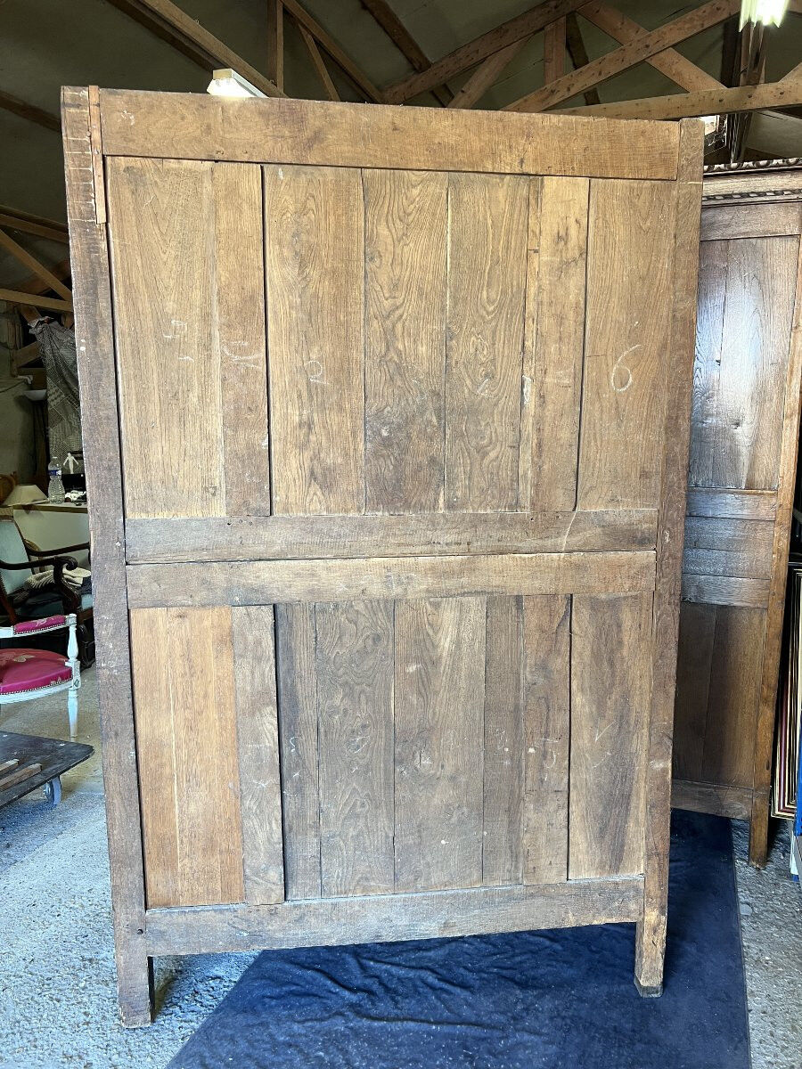 19th-century Norman wedding armoire, with bouquets of flowers and doves.