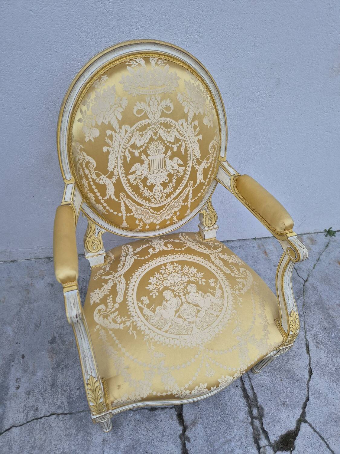 Louis XVI style cabriolet armchair with decorated medallion