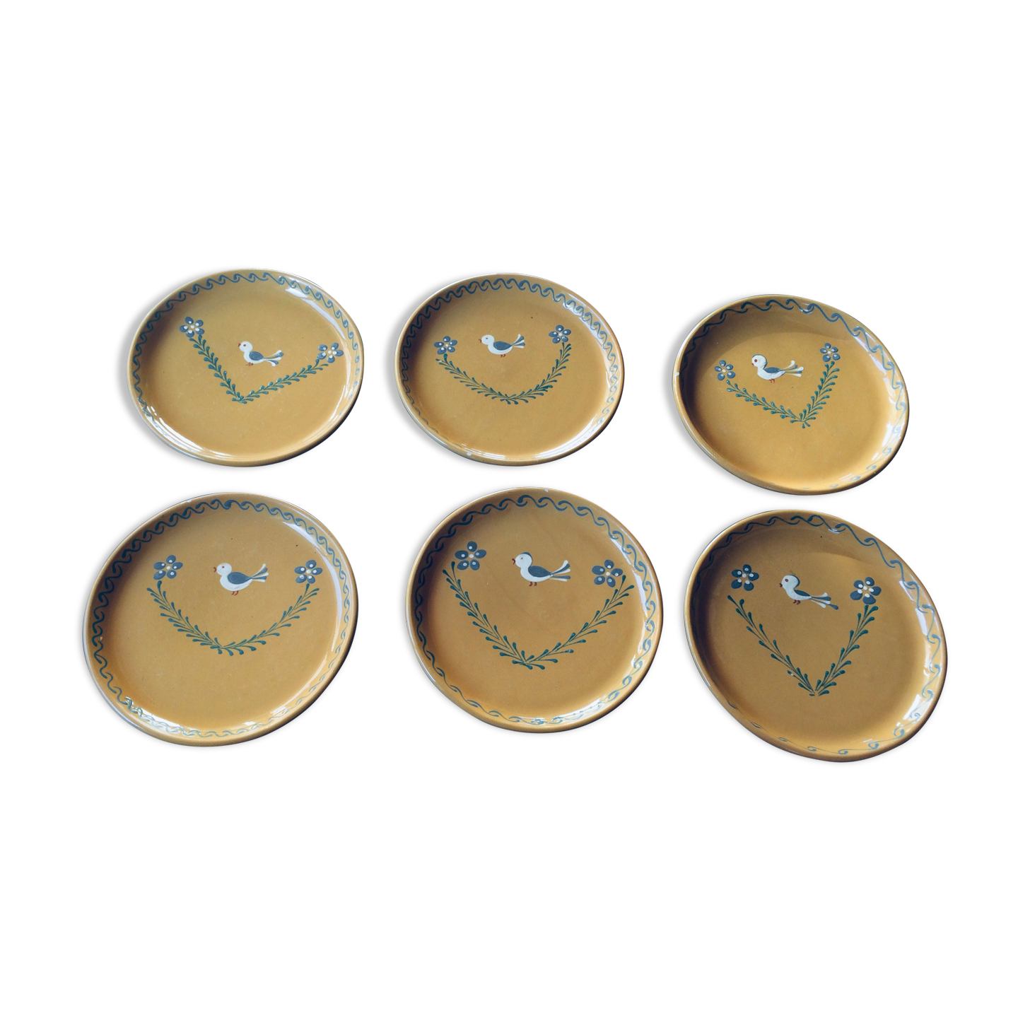The six Piaf plates in painted terracotta