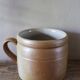Vase terracotta milk jug with a glazed interior handle.