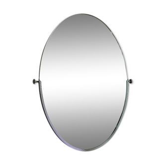 Vintage oval mirror in chromed metal. Tilting mirror of the 1970s 50x70cm