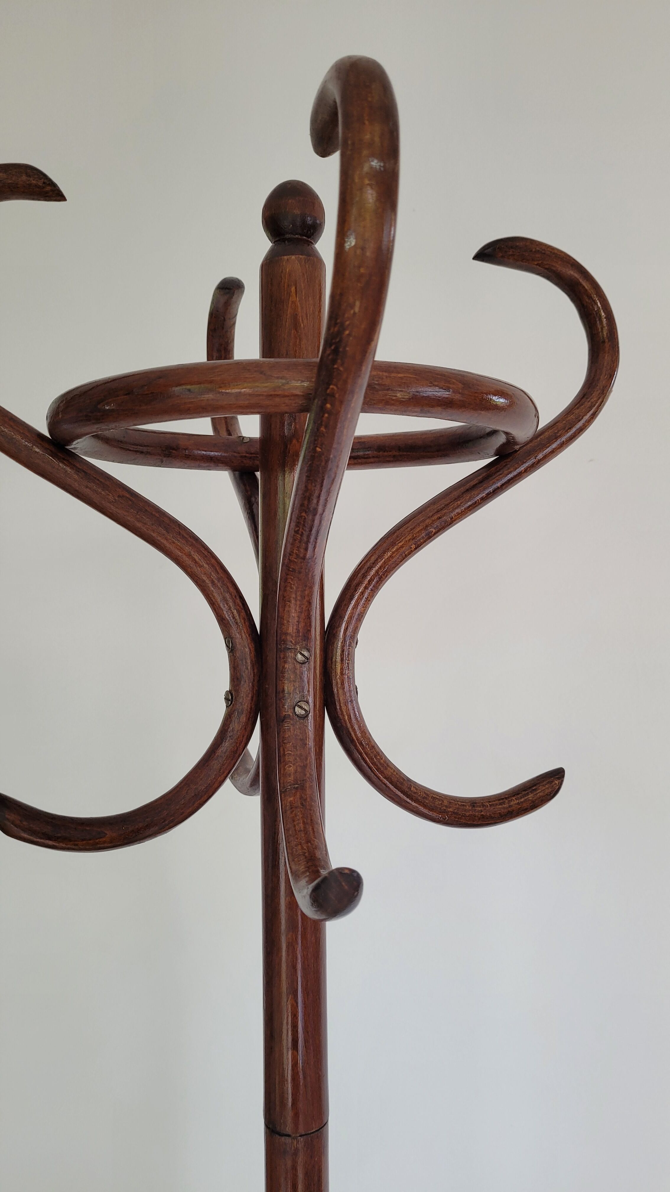 Wooden parrot coat rack on foot