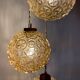 Suspension cascade trois feux globes vintage en verre ambré