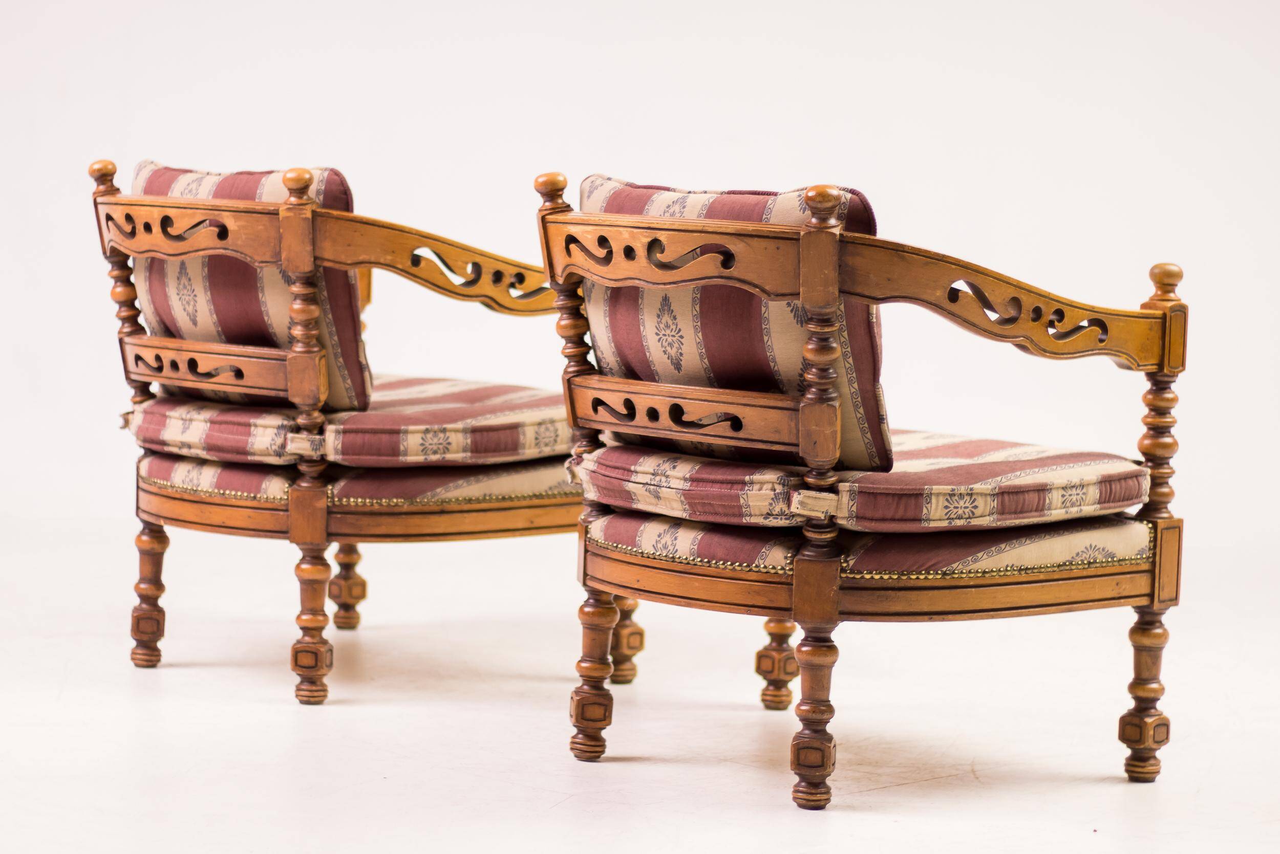 Pair of Giorgetti "1975 Gallery" armchairs in carved wood, original upholstery.