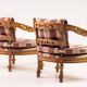 Pair of Giorgetti "1975 Gallery" armchairs in carved wood, original upholstery.